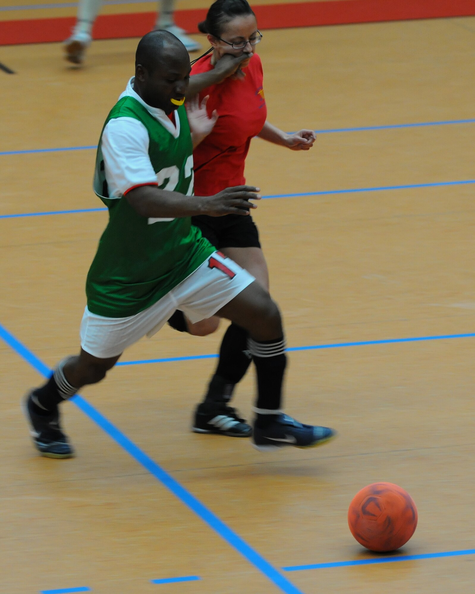 SPANGDAHLEM AIR BASE, Germany – Eric Dickson, left, 52nd Civil Engineer Squadron, and Christina O’Donnell, 52nd Medical Group, fight for possession of the ball during an intramural soccer game at the Skelton Memorial Fitness Center here April 28. The 52nd CES defeated the 52nd MDG 6-2. (U.S. Air Force photo/Airman 1st Class Dillon Davis)