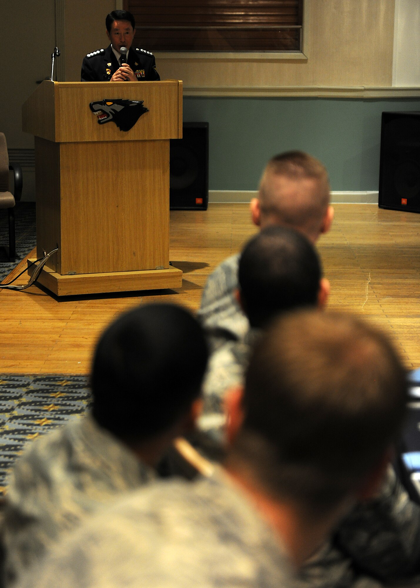 KUNSAN AIR BASE, Republic of Korea -- 8th Security Forces Squadron Airmen listen to Chief Na Yu-In, Gunsan Korean National Police chief, following a lunch at the Loring Club here May 3. Chief Na and Lt. Col. Mark Anarumo, 8th SFS commander, planned the event after they met and found a common bond in education, which they realized could benefit both of their forces. Colonel Anarumo plans to address the Gunsan City police in June. (U.S. Air Force photo/Senior Airman Ciara Wymbs)
