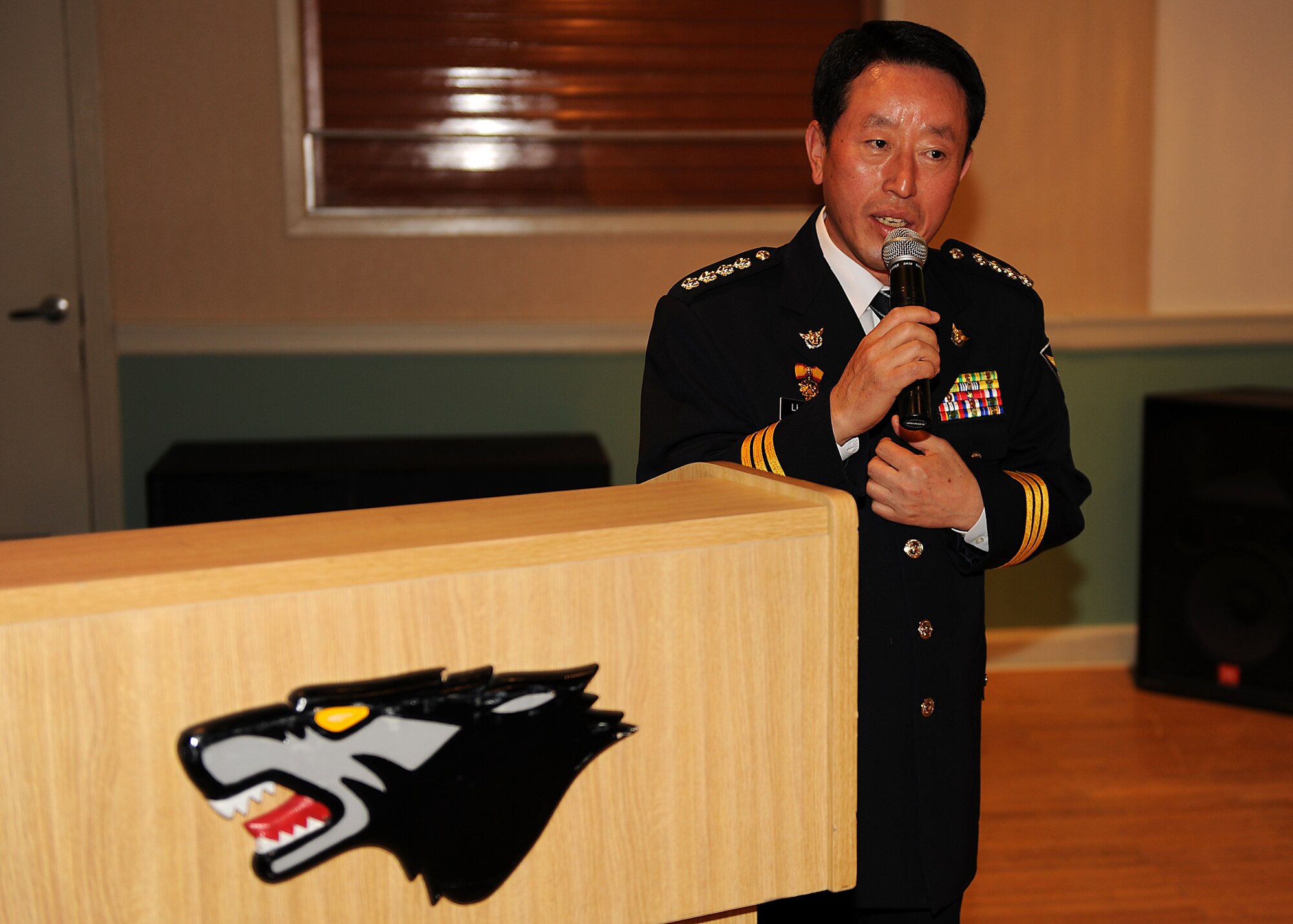 KUNSAN AIR BASE, Republic of Korea -- Chief Na Yu-In, Gunsan Korean National Police chief, addresses 8th Security Forces Squadron Airmen following a lunch at the Loring Club here May 3. Chief Na and Lt. Col. Mark Anarumo, 8th SFS commander, planned the event after they met and found a common bond in education, which they realized could benefit both of their forces. Colonel Anarumo plans to address the Gunsan City police in June. (U.S. Air Force photo/Senior Airman Ciara Wymbs)