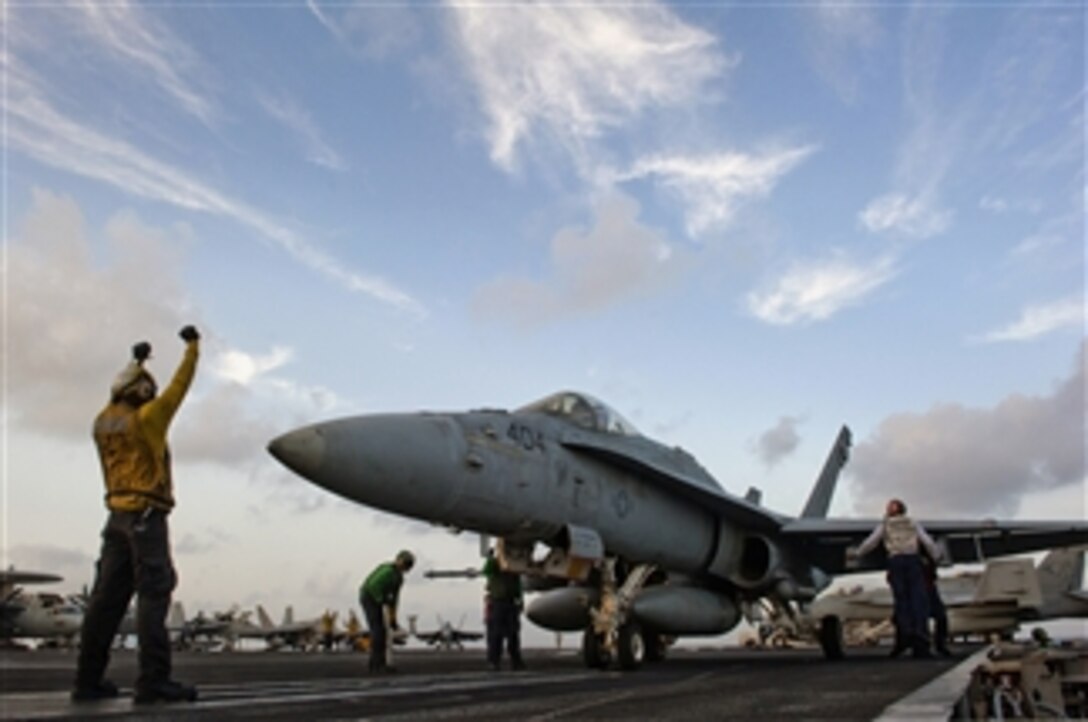 An F/A-18C Hornet assigned to Strike Fighter Squadron 25 is positioned on catapult No. 4 aboard the aircraft carrier USS Carl Vinson (CVN 70) in the Arabian Sea on April 30, 2011 .  The Carl Vinson and Carrier Air Wing 17 are conducting maritime security operations and close-air support missions in the U.S. 5th Fleet area of responsibility.  