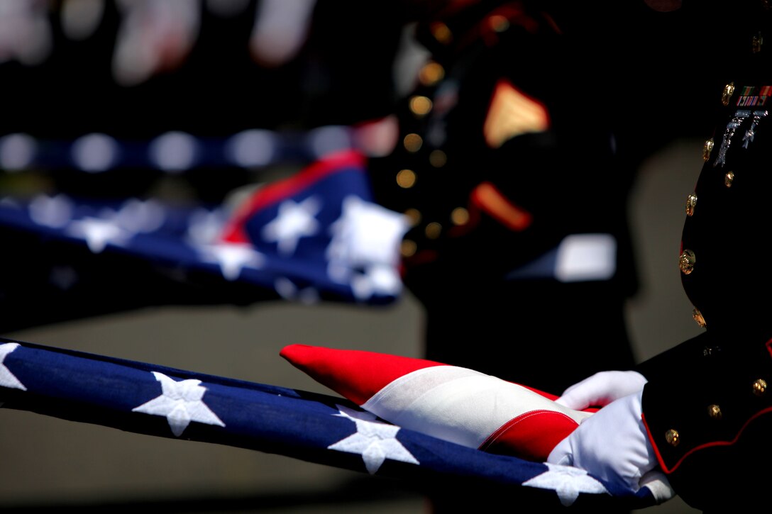 Local Marines fold flags for Lance Cpl. Joe Jackson’s family during his funeral May 4 at Tahoma Cemetery. Jackson was killed April 24 by an improvised explosive device blast in Afghanistan. (Official Marine Corps photo by Cpl. Jad Sleiman)