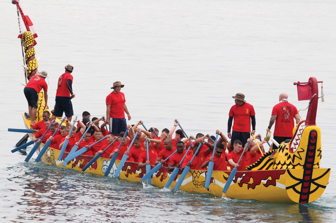 Male members of the Single Marine Program’s Team Devil Dog prepare to race against competitors during the 37th annual Naha Dragon Boat Race at the  Naha New Port Wharf May 5. The team won their first heat of the day and finished 3rd overall in their group. This year marked the SMP’s 14th year of participation in the annual races.