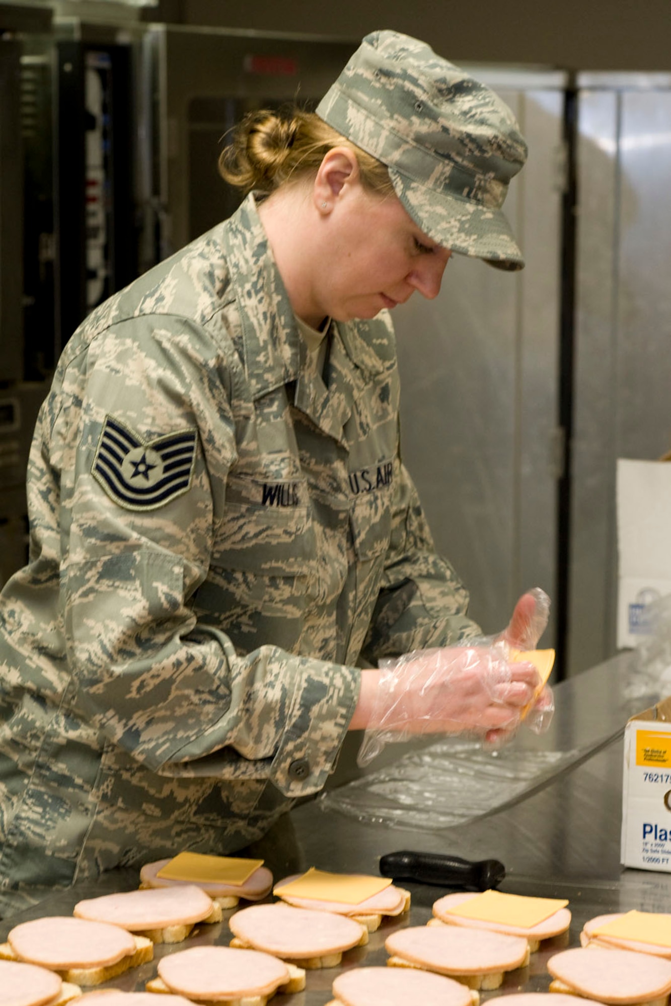 DANNELLY FIELD, Ala. - Tech. Sgt. Trisha Willis, services technician from 176th Sustainment Services Element, Alaska Air National Guard, prepares sandwiches for box lunches, May 5, 2011. Willis was at Danelly Field, Ala. to borrow the kitchen of the 187th Fighter Wing to make lunches for a group of deployers who were working out of Hayneville, Ala. There were about 70 deployers from numerous military components and services in Hayneville for an Innovative Readiness Training (IRT) mission. The IRT program allows for real world training opportunities for military personnel while providing needed services to under-served communities in the United States. Alaska Air National Guard photo by Master Sgt. Shannon Oleson.