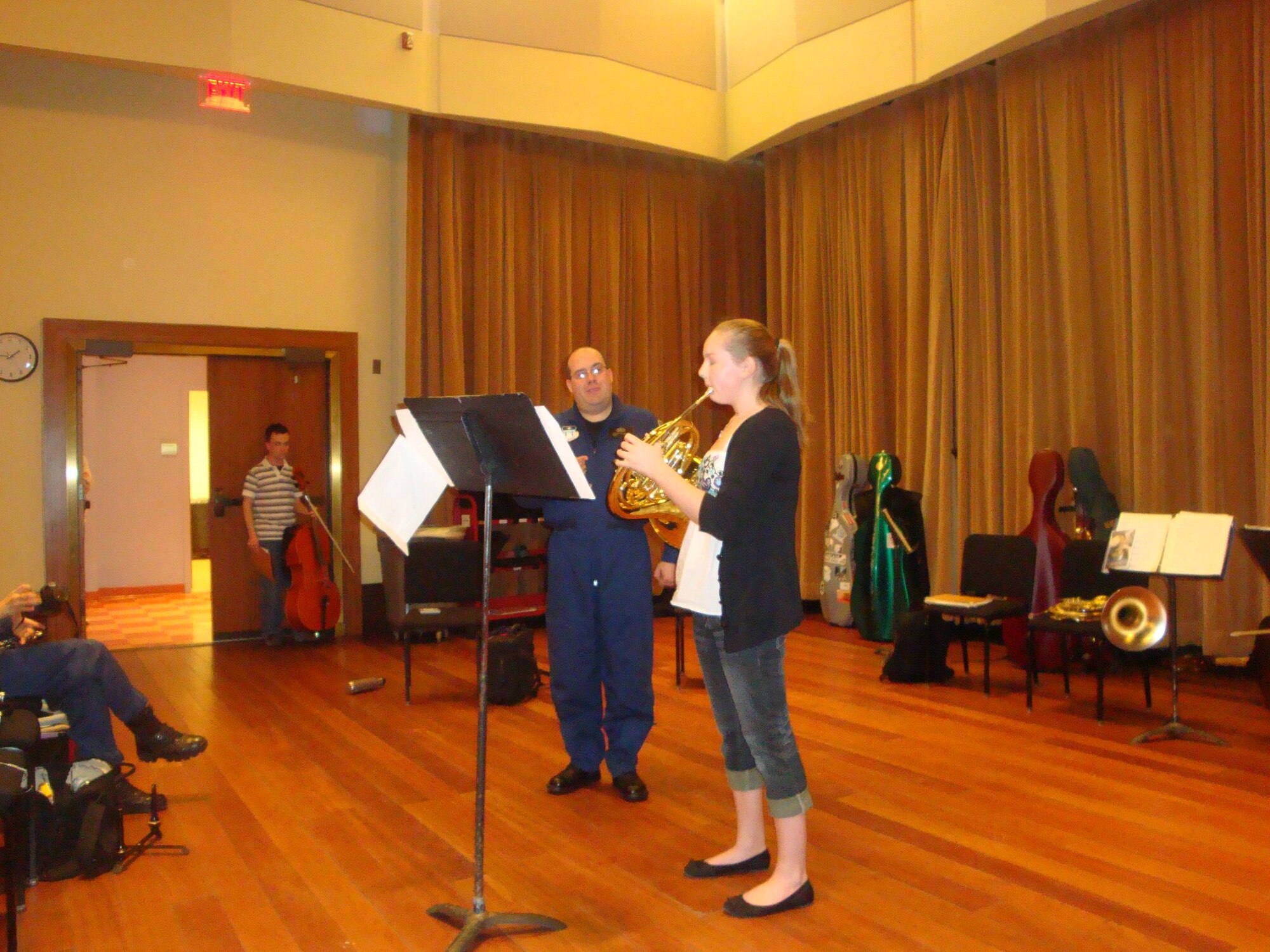 Technical Sergeant Ken Soper works on French Horn technique with a student from the Detroit Civic Youth Orchestra. Rampart Winds brings decades of professional musical expertise to masterclasses around the country.