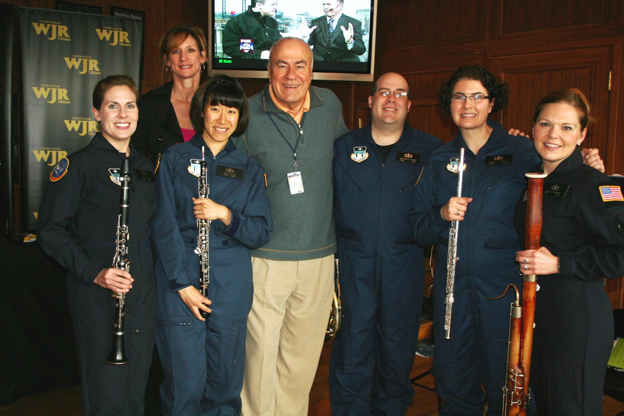 Here Rampart Winds poses with Frank Beckman and Teri Lieb from WJR radio in Detroit, Michigan. Rampart Winds had the unique opportunity to perform live on the radio show and talk about the Air Force message to an audience in the Detroit area.