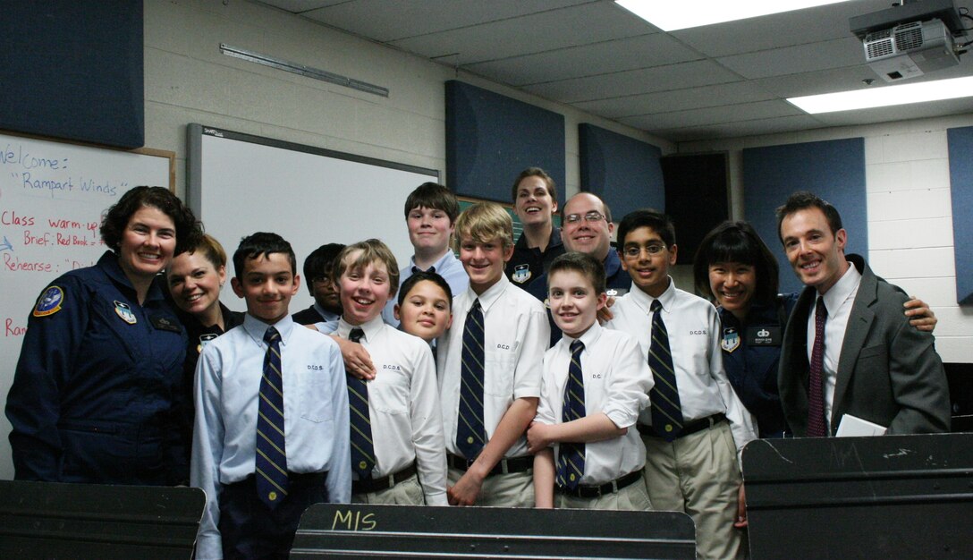 Rampart Winds poses with band students from the Detroit Country Day School in Beverly Hills, Michigan.