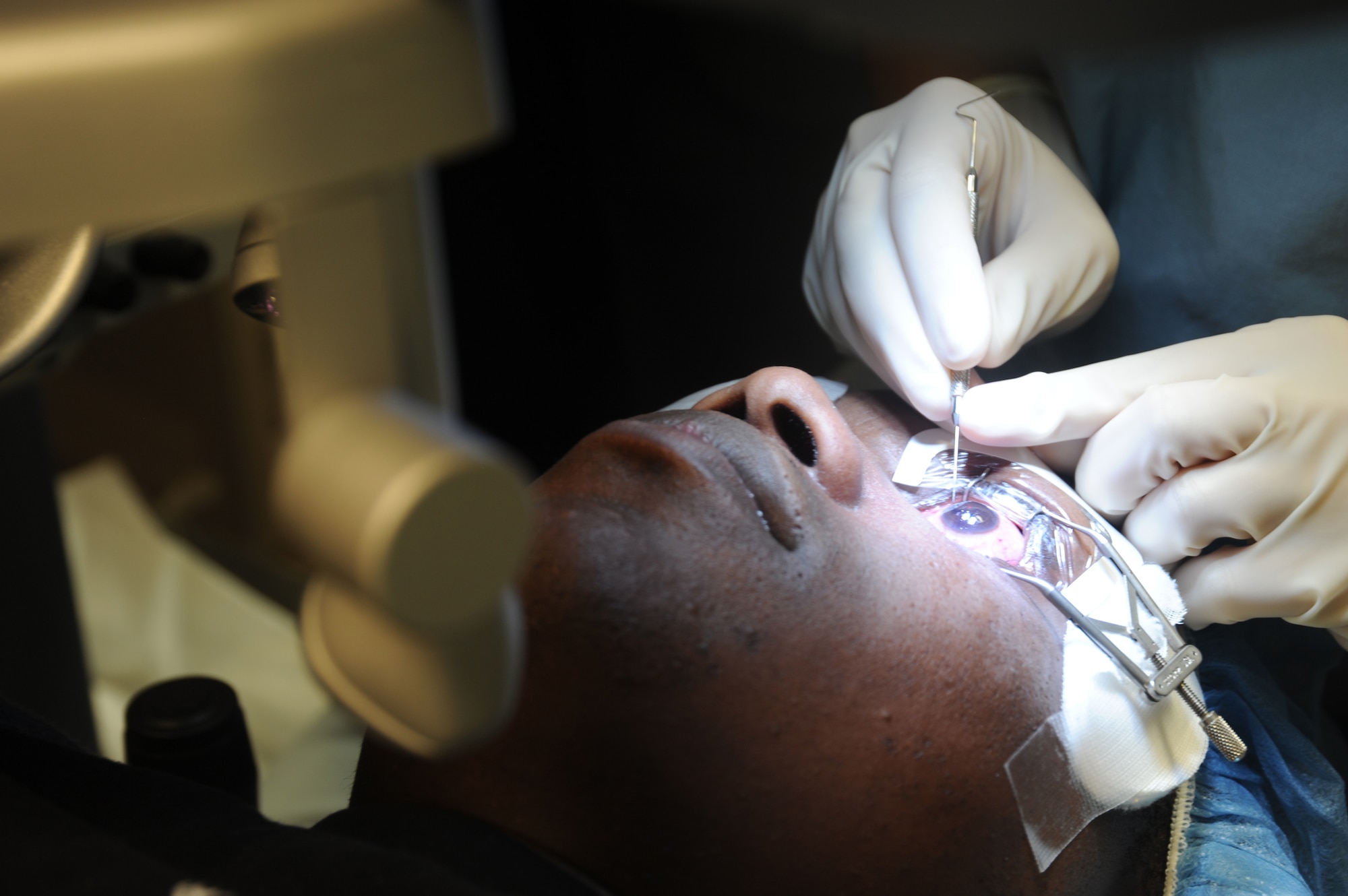 Maj. (Dr.) Vashuda Panday lifts the corneal flap of Army Staff Sgt. Stanley Arnold as a step in his LASIK refractive surgery March 3, 2011, at Lackland Air Force Base, Texas. Dr. Panday is the chief of cornea refractive surgery at the Joint Refractive Surgery Center and Sergeant Arnold is an instructor and infantryman at Ft. Huachuca, Ariz. (U.S. Air Force photo/Staff Sgt. Mareshah Haynes)
