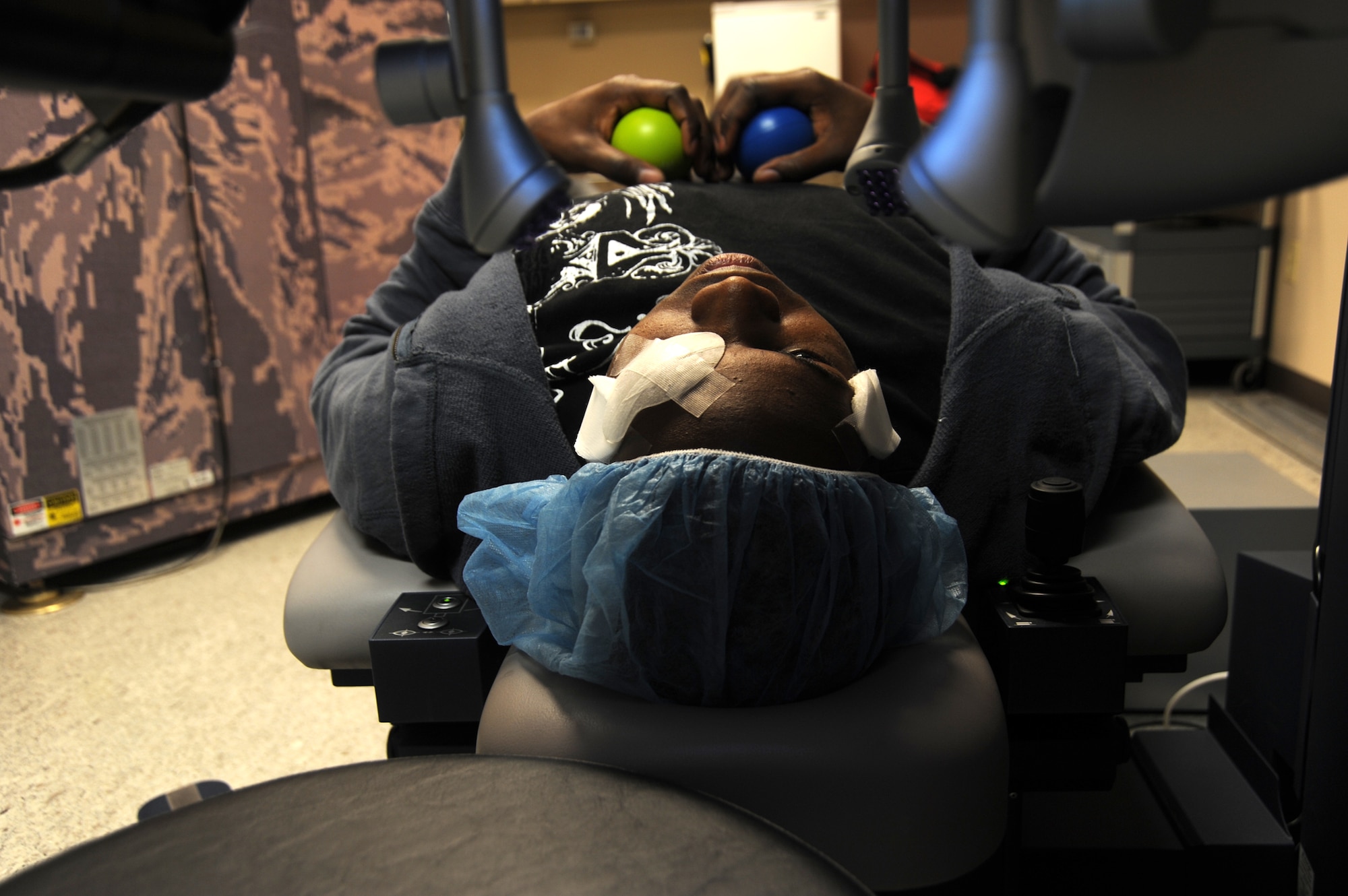 Army Staff Sgt. Stanley Arnold awaits the second half of his LASIK refractive surgery March 3, 2011, at the Joint Refractive Surgery Center at Lackland Air Force Base, Texas. The laser will lay down a treatment to smooth the surface of his eye, which will improve his vision. Sergeant Arnold is an instructor and infantryman at Ft. Huachuca, Ariz. (U.S. Air Force photo/Staff Sgt. Mareshah Haynes)

