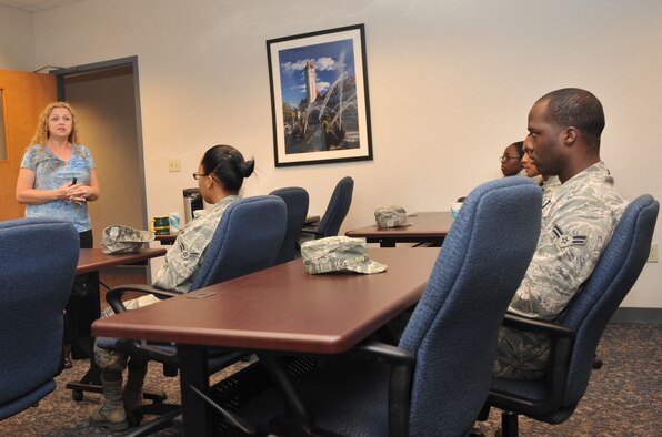 Lona Berndt, 375th Force Support Squadron Airmen and Family Readiness Center, brief Airmen receiving basic allowance for subsistence bout saving May 5, 2011, at Scott Air Force Base, Ill. Airmen can save money by printing off coupons for restaurants if their eating out. (U.S. Air Force Photo/ Airman 1st Class Divine Cox)