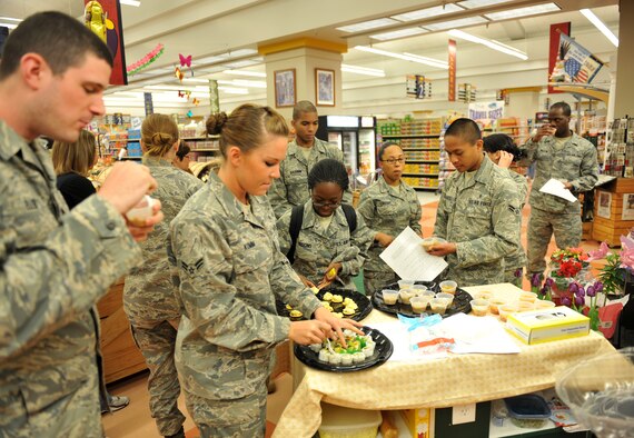 Airmen from Team Scott taste some recipes that are cost efficient to their budget May 5, 2011, at Scott Air Force Base, Ill. Airmen receiving BAS are taught how to make their money last the entire month. (U.S. Air Force photo/ Airman 1st Class Divine Cox) 