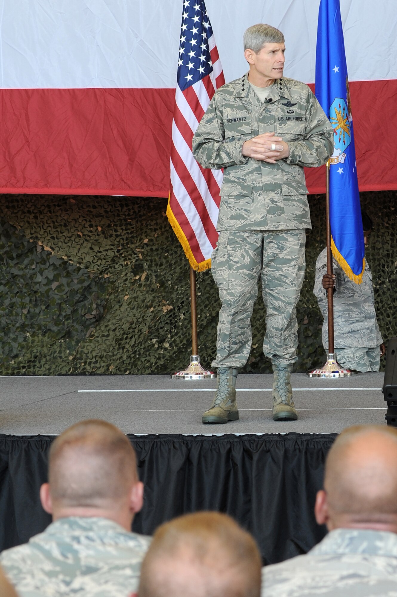 Air Force Chief of Staff Gen. Norton Schwartz answers questions from Airmen May 4, 2011, during an all call at Little Rock Air Force Base, Ark. General Schwartz answered questions regarding a variety of topics, including the current Air Force operations tempo and future deployment outlook. (U.S. Air Force photo/Airman 1st Class Rusty Frank)