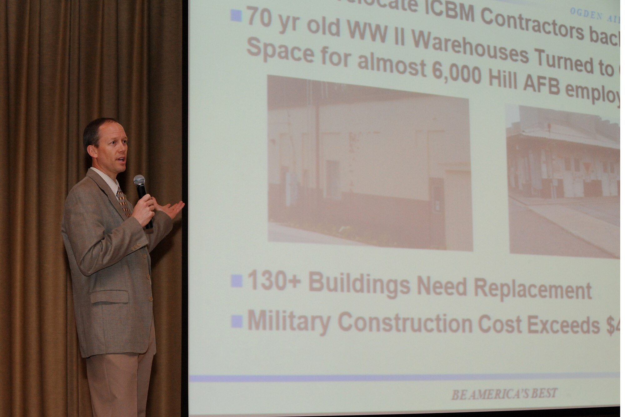 Darrin Wray, Falcon Hill's Enhanced Use Lease Program manager, speaks to those assembled at the Team Hill Junior Force Council series of talks as the opening speaker on April 27 at the Base Theater. (U.S. Air Force photo by Alex Lloyd)