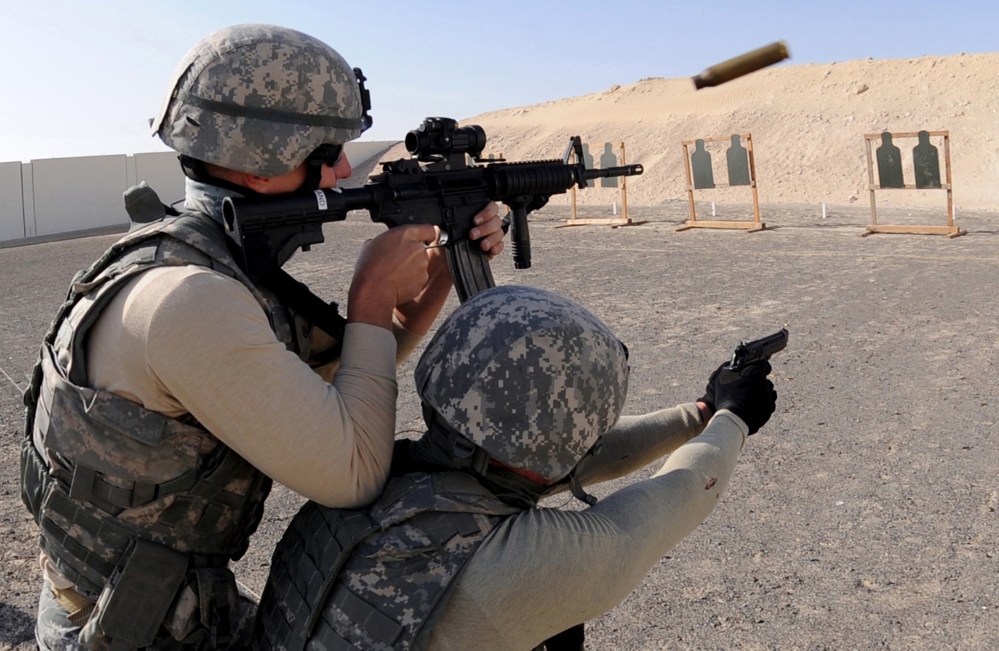 Security forces Airmen fire at targets Mar. 4, 2011, at a firing range in Southwest Asia. (U.S. Air Force photo/Senior Airman Maynelinne De La Cruz)
