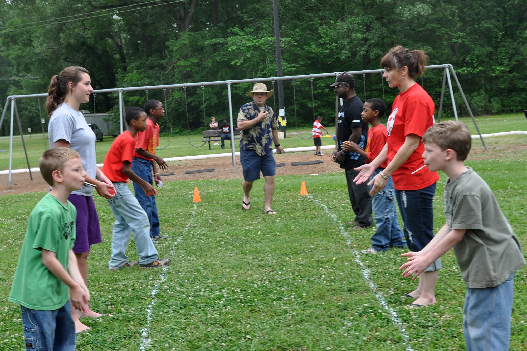 Participants at the 307th Bomb Wing’s Family Day enjoy a potentially wet game of balloon toss at Cullen Park on Barksdale Air Force Base, La., April 30, 2011. They also received a concert by recording artist Kimberly Caldwell and guitarist Michael Chaves. Ms. Caldwell may be best known as a second season contestant on the television show “American Idol.” The family day picnic, which is combined with a golf tournament, is used by the 307th BW commander to bring family members of 307th BW Airmen together to get to know each other as one big Air Force family. (U.S. Air Force photo/Betty Stephens)