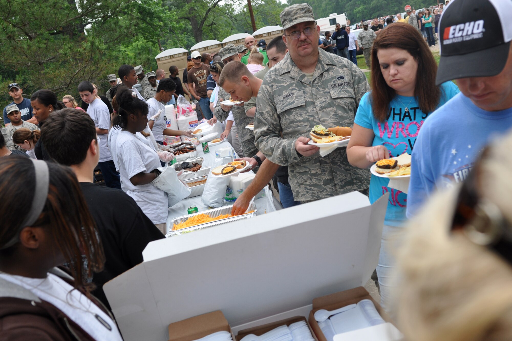 Participants at the 307th Bomb Wing’s Family Day a enjoy filling lunch, as well as many activities and a concert by Kimberly Caldwell and guitarist Michael Chaves at Cullen Park on Barksdale Air Force Base, La., April 30, 2011. Ms. Caldwell may be best known as a second season contestant on the television show “American Idol.” The family day picnic, which is combined with a golf tournament, is used by the 307th BW commander to bring family members of 307th BW Airmen together to get to know each other as one big Air Force family. (U.S. Air Force photo/Betty Stephens)