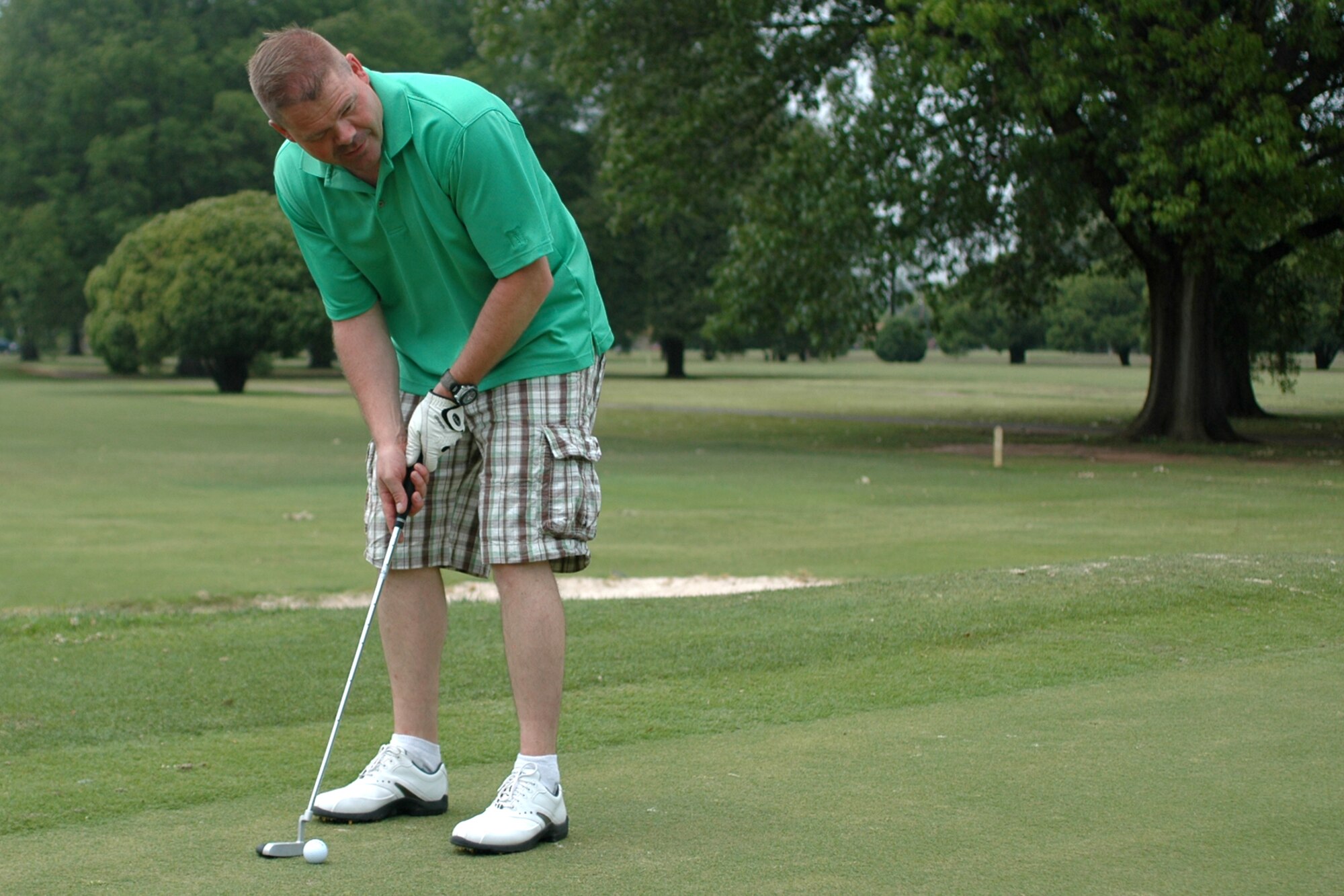 Wayne Southam lines up a putt during the 307th Bomb Wing Commander's Cup Golf Tournament at Fox Run Golf Course at Barksdale Air Force Base, La., April 30, 2011. The golf tournament, which is combined with a family day picnic, is used by the 307th BW commander to bring family members of 307th BW Airmen together to get to know each other as one big Air Force family. (U.S. Air Force photo/Staff Sgt. Ted Daigle)