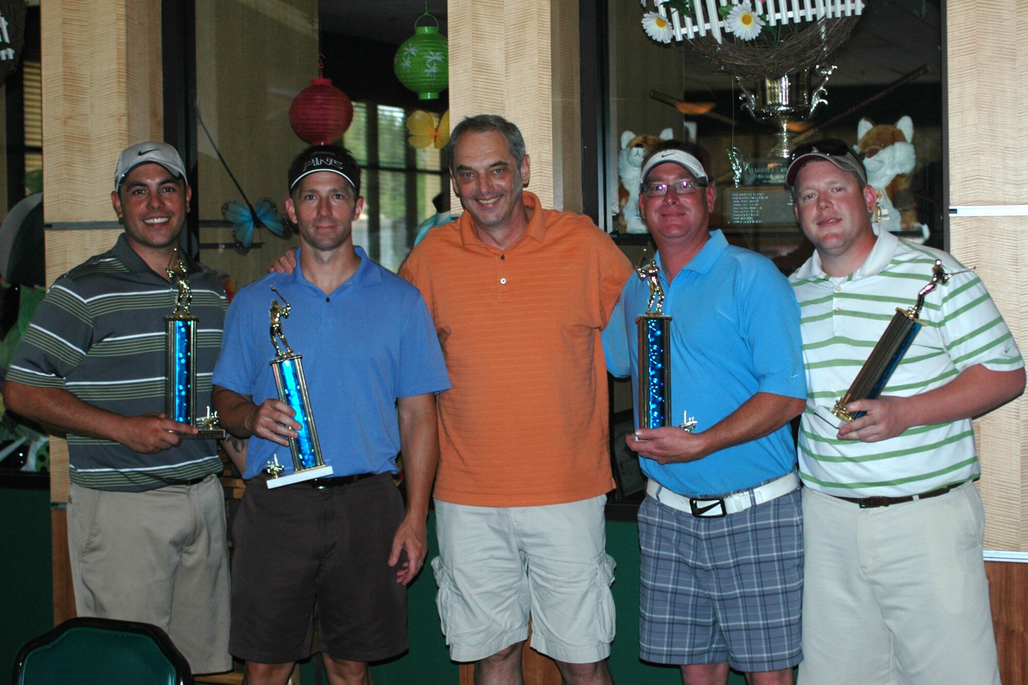 Brig. Gen. John J. Mooney III, (center) poses with the first place winners of the 307th Bomb Wing Commander's Cup golf tournament at the Fox Run Golf Course, at Barksdale Air Force Base, La., April 30, 2011. General Mooney is the 307th BW commander and this year’s host of the annual event. Members of the winning team were Jonathon Wilson, Joshua Wendt, Will Rhodes and Richard Bourgeois. The golf tournament, which is combined with a family day picnic, is used by the 307th BW commander to bring family members of 307th BW Airmen together to get to know each other as one big Air Force family. (U.S. Air Force photo/Staff Sgt. Ted Daigle)