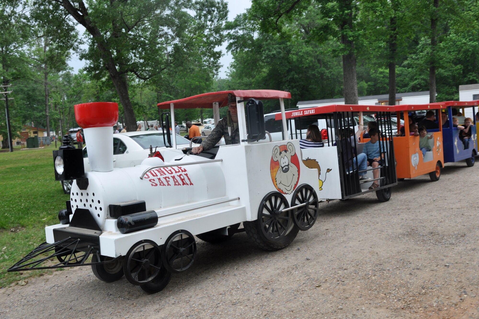 Some of the participants at the 307th Bomb Wing’s Family Day enjoy a ride on the Jungle Safari train at Cullen Park on Barksdale Air Force Base, La., April 30, 2011. The family day picnic, which is combined with a golf tournament, is used by the 307th BW commander to bring family members of 307th BW Airmen together to get to know each other as one big Air Force family.  (U.S. Air Force photo/Betty Stephens)