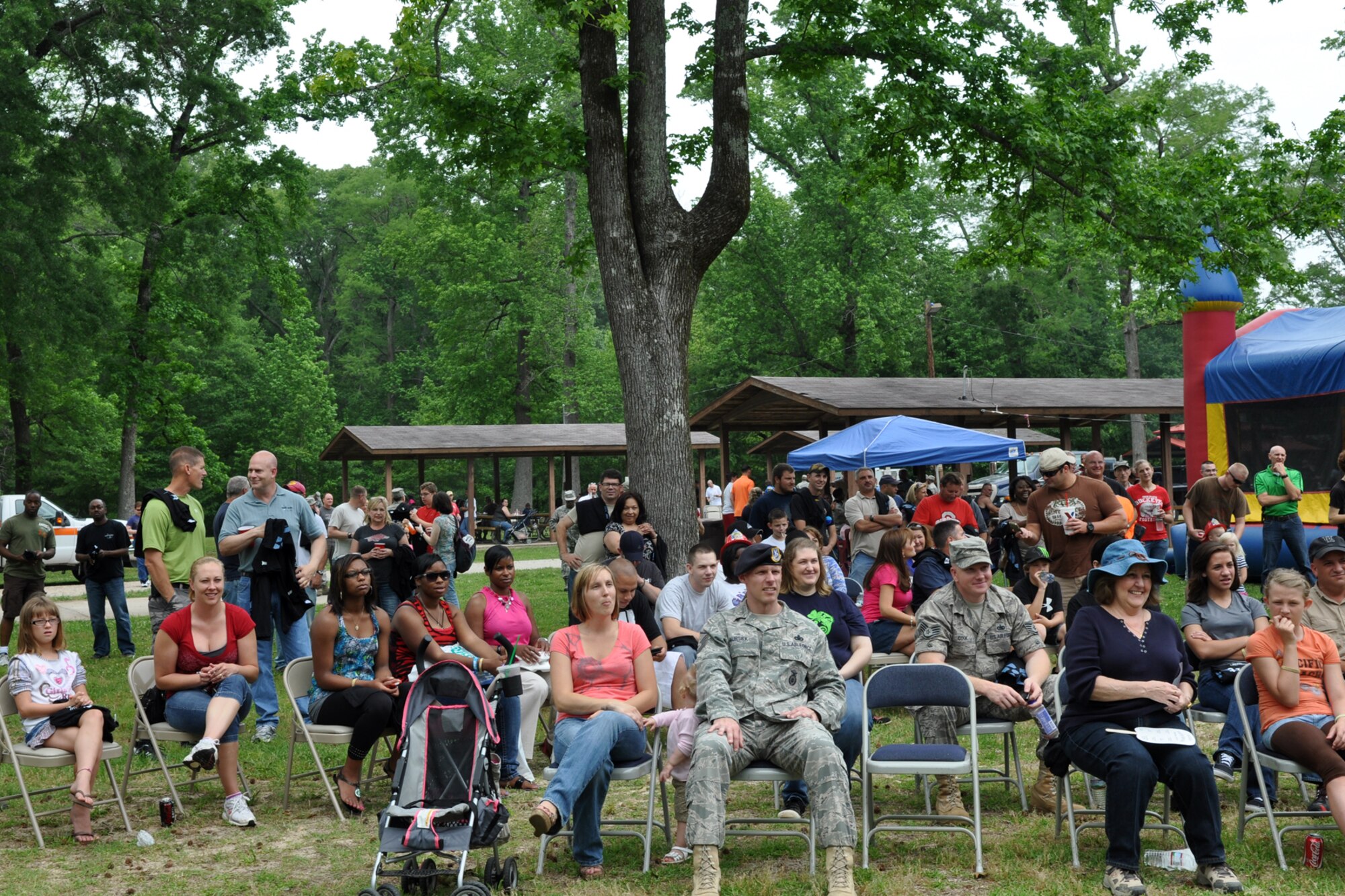 Participants at the 307th Bomb Wing’s Family Day enjoy a concert by Kimberly Caldwell and guitarist Michael Chaves at Cullen Park on Barksdale Air Force Base, La., April 30, 2011. Ms. Caldwell may be best known as a second season contestant on the television show “American Idol.” The family day picnic, which is combined with a golf tournament, is used by the 307th BW commander to bring family members of 307th BW Airmen together to get to know each other as one big Air Force family.  (U.S. Air Force photo/Betty Stephens)