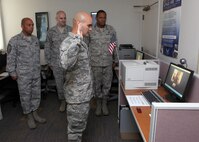 Tech. Sgt. Joe Hernandez, 319th Training Squadron, reaffirms the oath of enlistment via Skype to his wife, Capt. Teresa Hernandez, Defense Logistics Agency officer in charge at Kandahar Air Base, Afghanistan, during his promotion ceremony April 29 at the Airman and Family Readiness Center. Sergeant Hernandez was promoted to master sergeant. (U.S. Air Force photo/Robbin Cresswell)