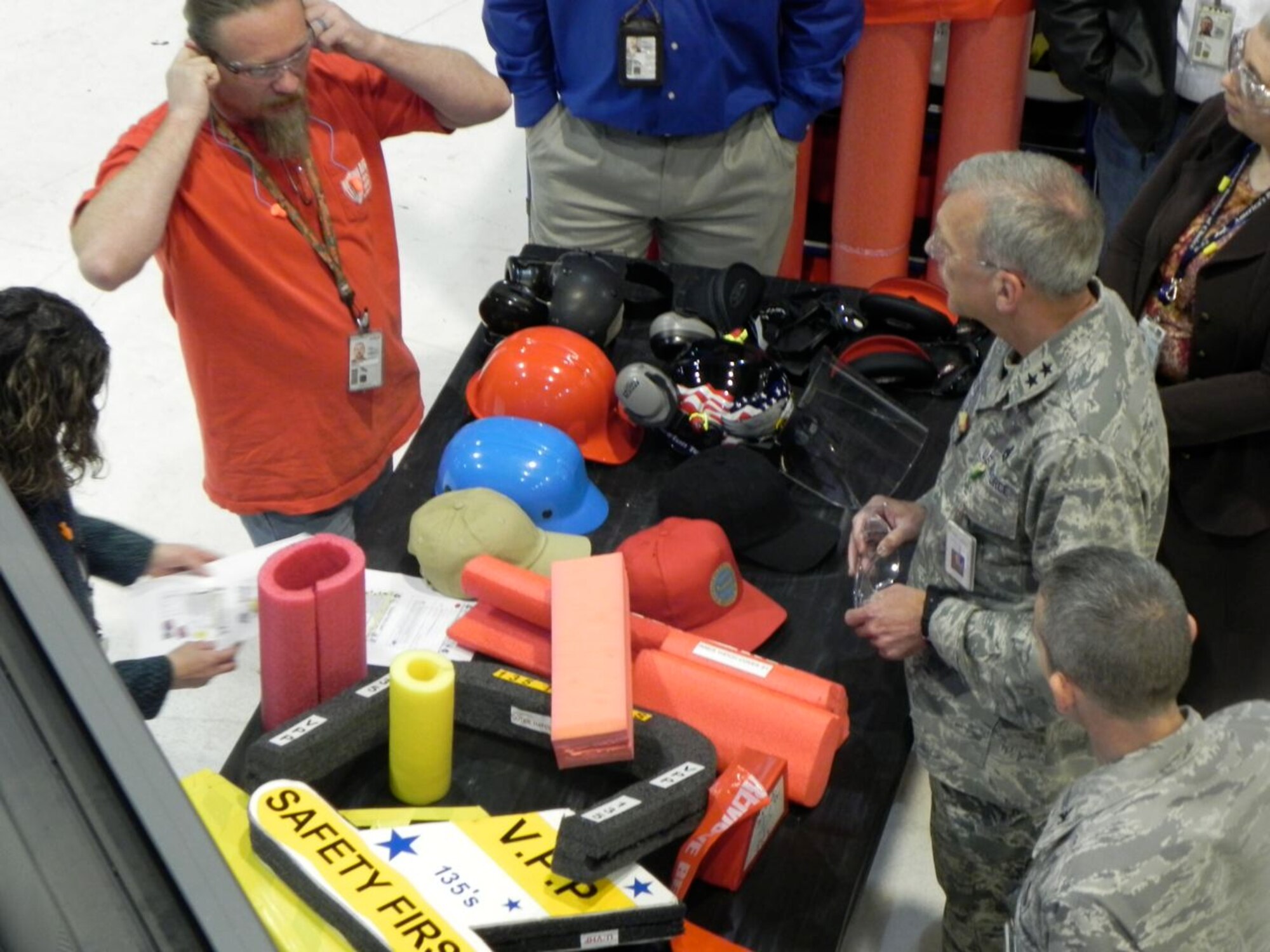 Delo Anderson, 76th Aircraft Maintenance Group Integrated Design Team union representative, shows Maj. Gen. David Gillett, Oklahoma City Air Logistics Center commander, a safety initiative the group has been working on. In an effort to protect the workforce when working near an aircraft’s sharp edges, blocks of foam are put on the areas. The group has created a prototype kit and are adjusting it for each of the weapon systems. (Air Force photo by Keith Kingsbury)