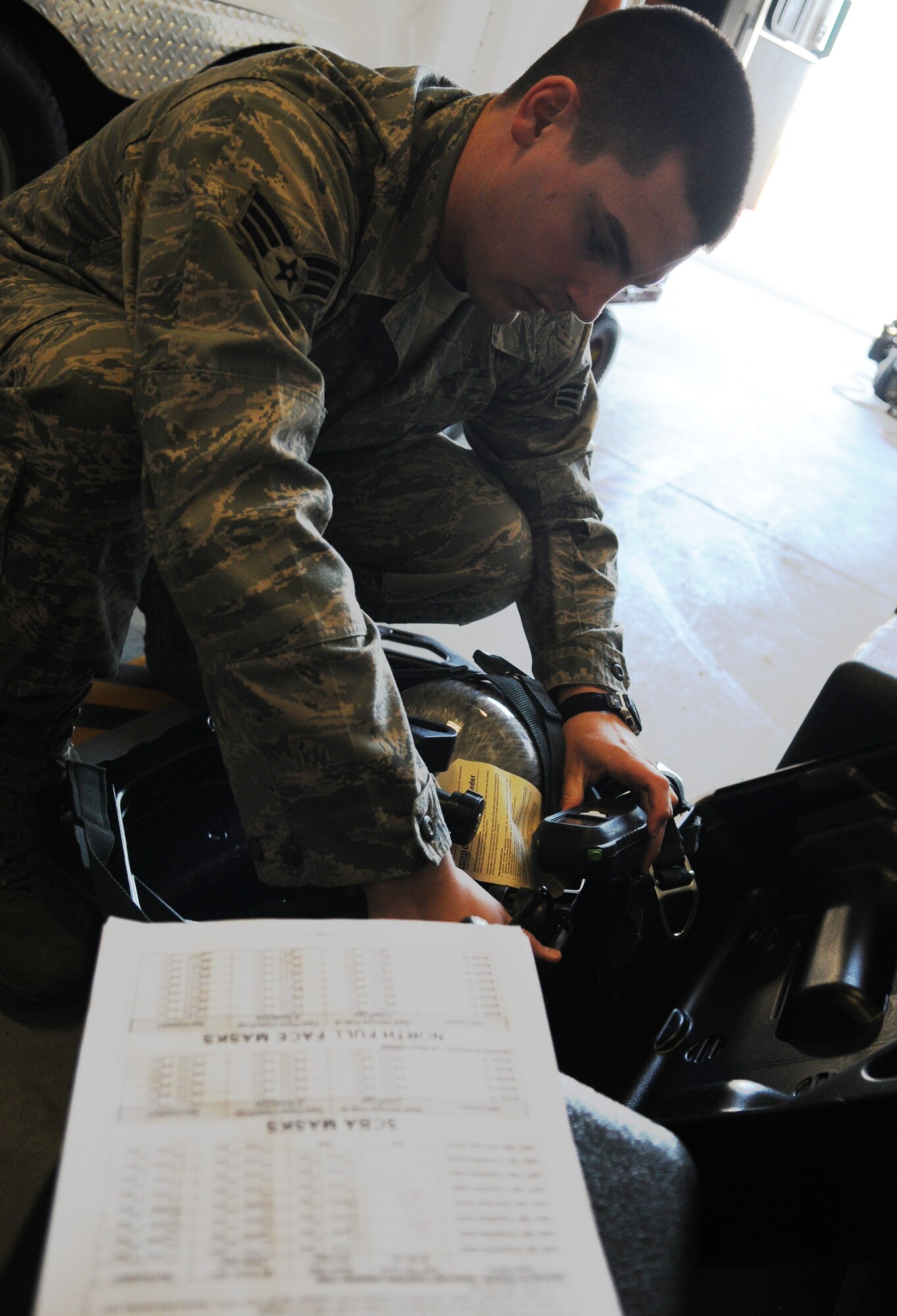 Senior Airman Samuel Bergh checks to make sure a breathing air pack is serviceable April 25, 2011, Eielson Air Force Base, Alaska. Bioenvironmental engineers perform equipment inspections monthly as most of the equipment is used for emergency response. Airman Bergh is assigned to the 354th Medical Operations Squadron Bioenvironmental Engineering section. (U.S. Air Force photo/Senior Airman Rachelle Coleman)