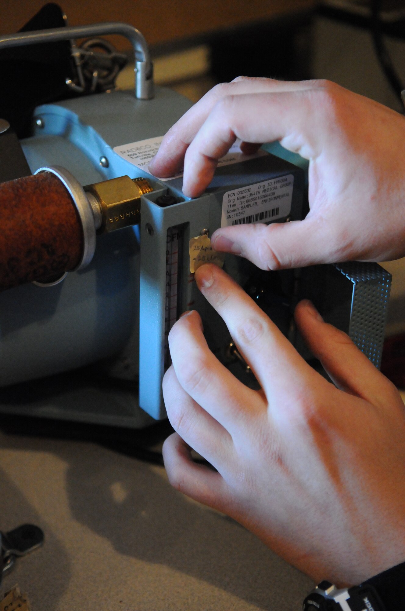 The adjusted calibration is marked on a piece of equipment April 25, 2011, Eielson Air Force Base, Alaska. Bioenvironmental Engineering Airmen are responsible for maintaining and calibrating survey equipment monthly. (U.S. Air Force photo/Senior Airman Rachelle Coleman)