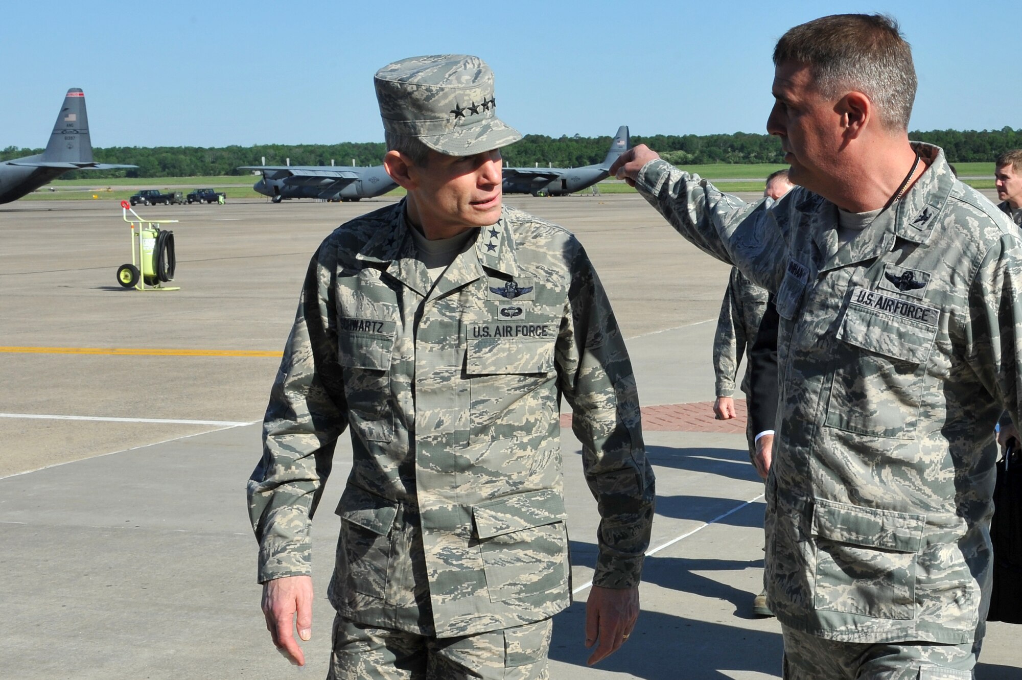 Air Force Chief of Staff Gen. Norton Schwartz talks with Col. Michael Minihan, 19th Airlift Wing commander, May 4, 2011, at Little Rock Air Force Base, Ark., during a base visit. General Schwartz was previously assigned to Little Rock AFB during his C-130 Hercules initial qualification training and as a C-130E/H flight examiner. (U.S. Air Force photo/Staff Sgt. Chris Willis)