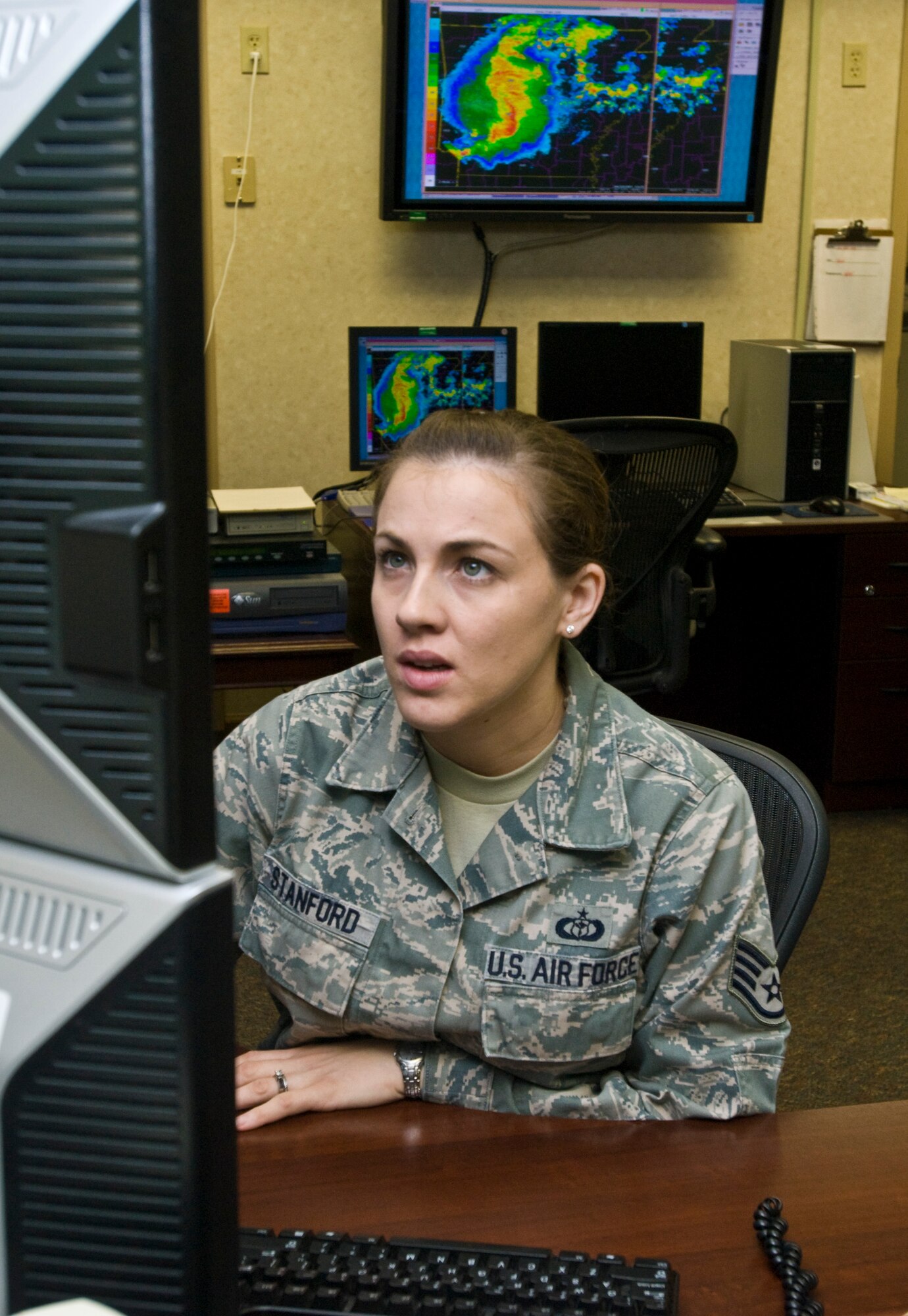 Staff Sgt. April Stanford, 19th Operations Support Squadron NCO-in-charge of mission services, monitors a lightning warning April 25, 2011, at Little Rock Air Force Base, Ark., hours before a tornado struck the base.  Weather flight forecasters tracked and monitored the tornado which turned out to be an EF-2 tornado on the Enhanced Fujita Scale (111-135 mph). (U.S. Air Force photo by Staff Sgt. Nestor Cruz)