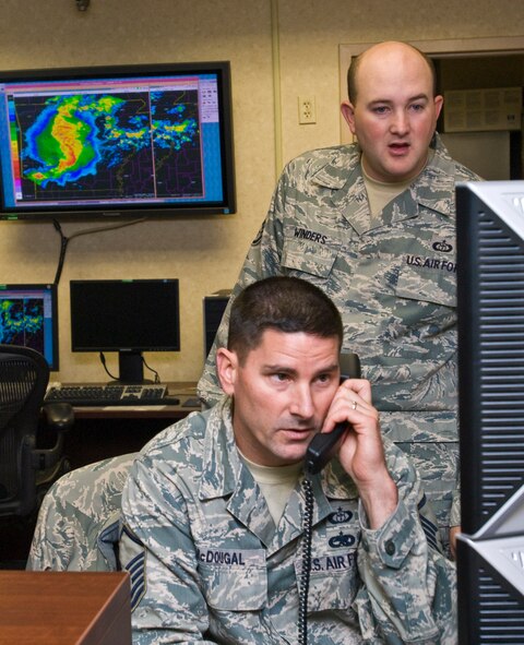 Master Sgt. Rodney McDougal (foreground), 19th Operations Support Squadron NCO-in-charge of weather flight, and Staff Sgt. Michael Winders, a 19th OSS weather flight technician, conduct a severe weather analysis April 25, 2011, at Little Rock Air Force Base, Ark., hours before a tornado struck the base. Weather flight forecasters tracked and monitored the tornado which turned out to be an EF-2 tornado on the Enhanced Fujita Scale (111-135 mph). (U.S. Air Force photo/Staff Sgt. Nestor Cruz)
