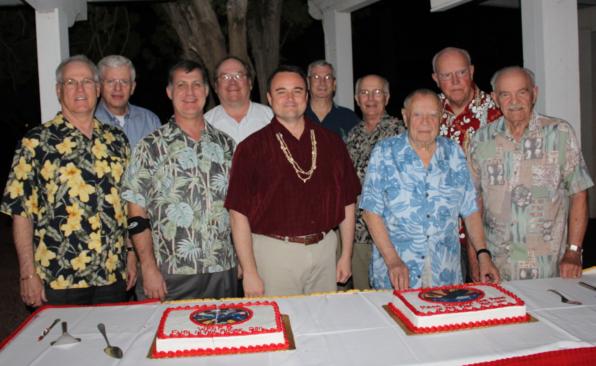 As they prepare to transition operations to Wright-Patterson Air Force Base, Ohio, personnel from the 711th Human Performance Wing, Human Effective Directorate’s Warfighter Readiness Research Division (711 HPW/RHA) at the Mesa Research Site, Ariz., held a three-day homecoming event celebration. The celebration ended with an “Aloha” themed dinner. Attendees included division chiefs, and technical directors and advisors representing each decade that the division has been in existence. Front row: Colonel (Ret) Dan Eliason, Division Chief, 1982-1986; Colonel (Ret) Dan Walker, Division Chief, 2005-2010; Lieutenant Colonel Joel Boswell, Division Chief, 2010-present; Dr. William Hagin, Technical Director, 1969-1976; Lieutenant Colonel (Ret) David Andersen, Division Chief, 1970-1971. Back Row: Dr. Herbert Bell,  Technical Adviser, 2002-present; Dr. Dee Andrews, Technical Director, 1997-2002, (currently 711 HPW Senior Scientist); Colonel (Ret) Lynn Carroll (Division Chief, 1991-1999); Colonel (Ret) Mike Lane, (Division Chief 1986-1988); and Dr. Milt Wood, Behavioral Scientist and Technical Director, 1969-1986). (U.S. Air Force photo)