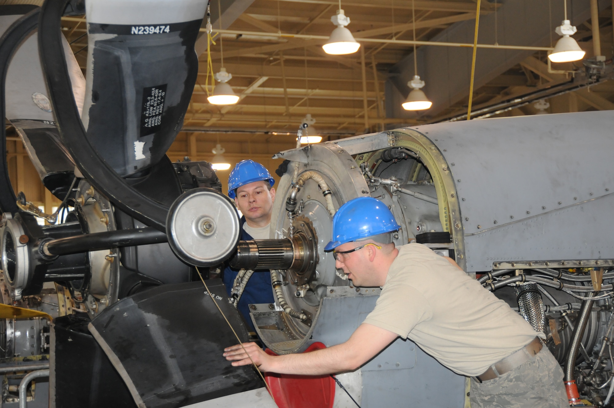 107th Maintenance personnel from the Propulsion shop intalll a the Allison T56 is a single shaft, modular design military turboprop on the C-130 aircraft on May 4, 2011. TSgt Aaron Clause and TSgt Dan Weiser guide the prop on the T56 engine.(Air Force Photo/SMSgt Ray Lloyd)
