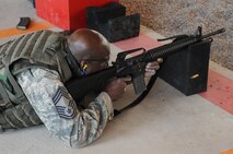 LAUGHLIN AIR FORCE BASE, Texas – Chief Master Sgt. Michael King, 47th Mission Support Group superintendent, participates in a weapon qualifications course held at Laughlin’s firing range May 4. (U.S. Air Force photo by Senior Airman Scott Saldukas)