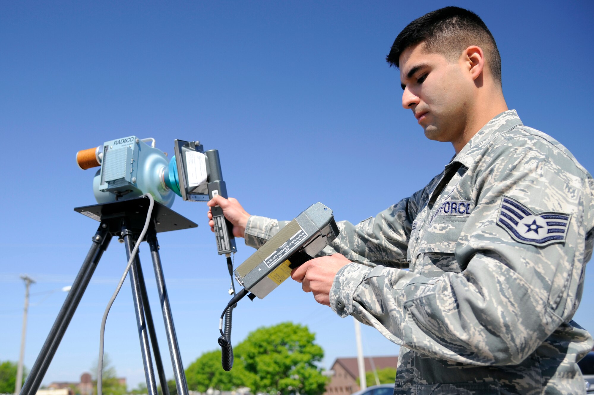 WHITEMAN AIR FORCE BASE, Mo. - Staff Sgt. Edwin Origel, 509th Medical Operations Squadron bioenvironmental technician, samples the level of alpha particles in the air here May 3, 2011. These samples are part of a study to see how far radiation has reached from the Fukushima Dai-ichi nuclear plant melt down. All readings have been normal and radiation spikes are not expected, however, in support of the study bioenvironmental sampling will continue until further notice. (U.S. Air Force photo by Airman 1st Class Cody H. Ramirez)