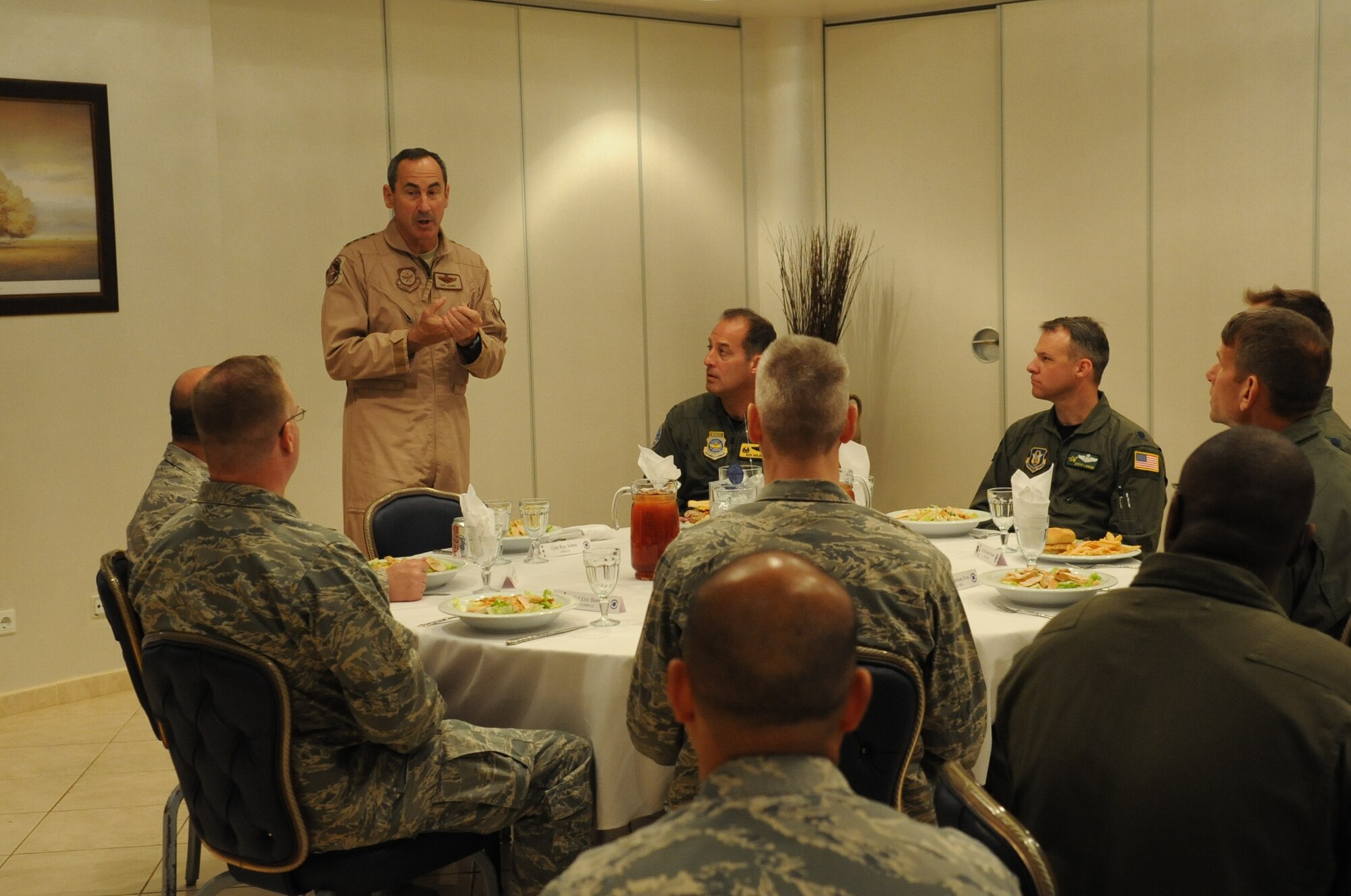Gen. Raymond E. Johns Jr., the commander of Air Mobility Command, speaks to wing leadership before lunch March 26, 2011, at Incirlik Air Base, Turkey.  General Johns visited the base to learn more about how AMC Airmen are supporting the U.S. Air Forces in Europe mission. (U.S. Air Force photo by Airman 1st Class Clayton Lenhardt)