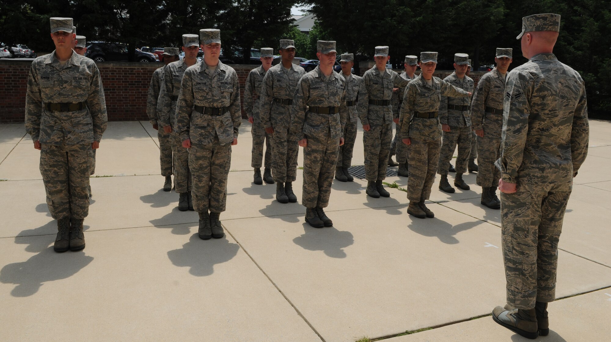 Airman 1st Class Kylee Cook, U.S. Air Force Honor Guard training instructor, orders the trainees to fall into formation May 3 at Joint Base Anacostia-Bolling, Washington, D.C. The USAF Honor Guard trainees are inspected regularly for dress and appearance standards and evaluated weekly. (U.S. Air Force photos by Senior Airman Christopher Ruano)