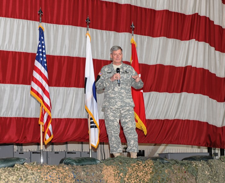 KUNSAN AIR BASE, Republic of Korea -- Gen. Walter Sharp, commander, United Nations Command, Combined Forces Command, U.S. Forces Korea, addresses Wolf Pack Airmen here May 4 during his visit to present Kunsan’s Pacific Air Forces operational readiness inspection outstanding performers with his personal coin and extend words of gratitude and appreciation for a job well done on the 8th Fighter Wing’s ‘Excellent’ rating. (U.S. Air Force photo/Senior Airman Brittany Bateman)