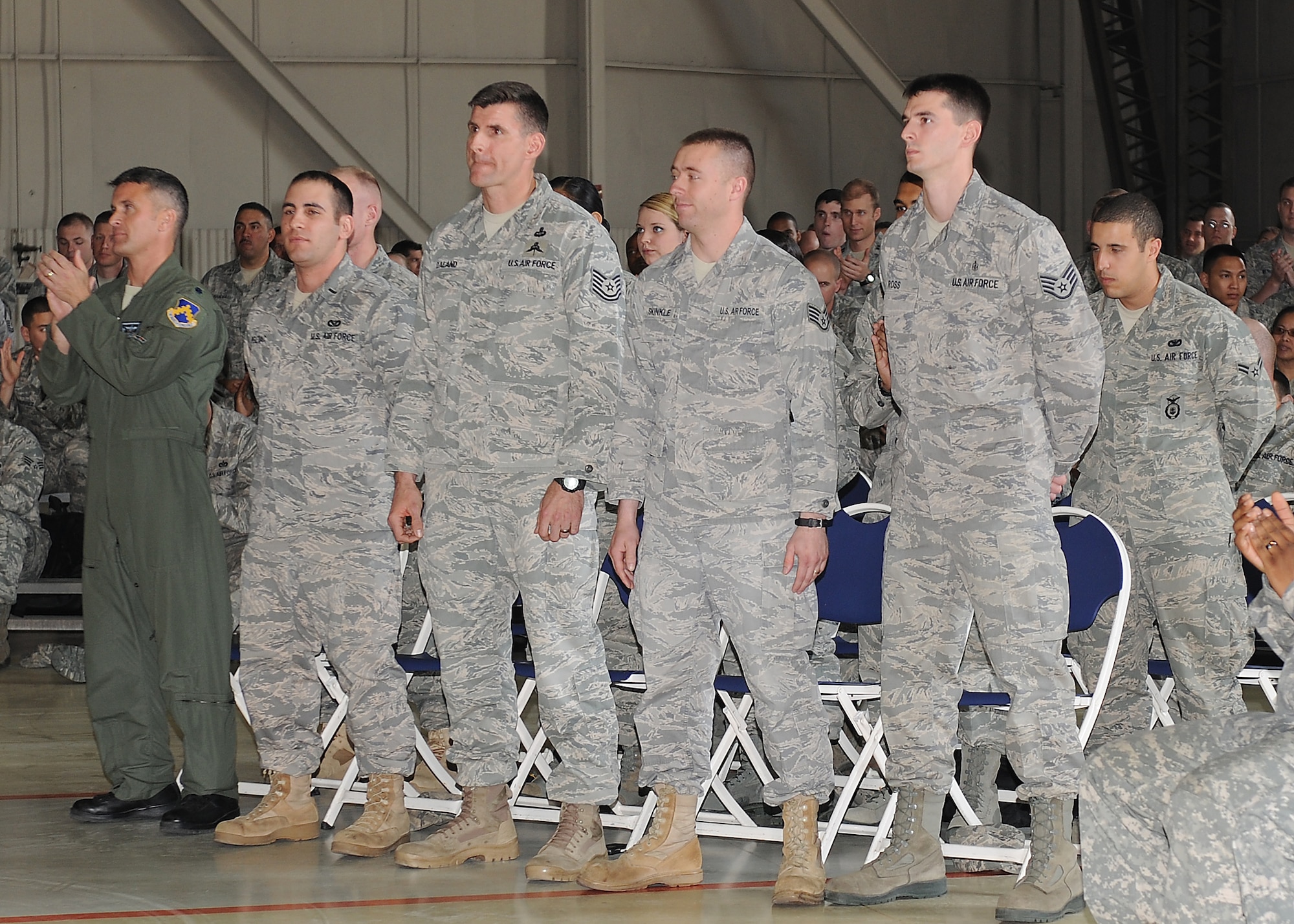 KUNSAN AIR BASE, Republic of Korea -- Coin recipients receive applause from those in attendance at a coin ceremony led by the commander, United Nations Command, Combined Forces Command, U.S. Forces Korea, Gen. Walter Sharp, who visited here May 4 to present Kunsan’s Pacific Air Forces operational readiness inspection outstanding performers with his personal coin and extend words of gratitude and appreciation for a job well done on the 8th Fighter Wing’s ‘Excellent’ rating. (U.S. Air Force photo/Senior Airman Brittany Bateman)