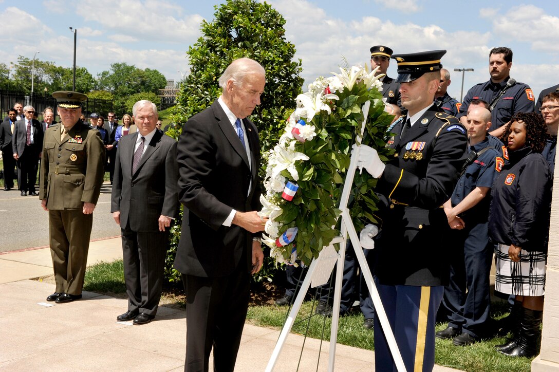Vice President Joe Biden places a wreath at the Pentagon Memorial, May 5, 2011, in honor of the 184 who were killed there on Sept. 11, 2001. Defense Secretary Robert M. Gates and Marine Corps Gen. James E. Cartwright, vice chairman of the Joint Chiefs of Staff, look on along with Arlington County, Va., firefighters who were among the first responders to the disaster.  The ceremony took place four days after 9/11 mastermind Osama bin Laden, al-Qaida's leader, was killed during a U.S. military raid in Pakistan. 