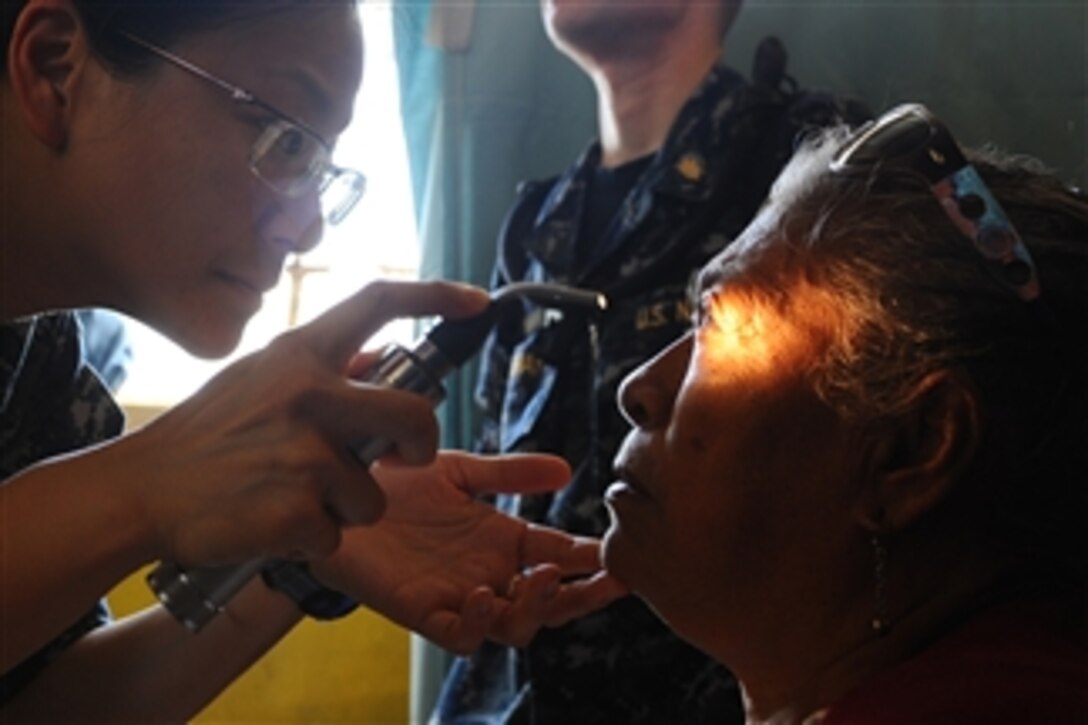 U.S. Navy Lt. Eva Chou, an ophthalmologist, exams a patient at a medical clinic in Sagrado Corzon de Jesus School during a Continuing Promise medical community service project in Paita, Peru, on May 1, 2011.  Continuing Promise is a five-month humanitarian assistance mission to the Caribbean, Central and South America.  