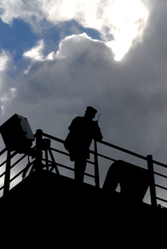 A sailor aborad the HSV-2 Swift watches as the ship safely docks at Agadir, Morocco. The ship was delivering service members and supplies to support Exercise African Lion 2011. ::r::::n::Exercise African Lion is an annually scheduled, joint, combined U.S.-Moroccan exercise. It brings together nearly 2,000 U.S. service members from locations throughout Europe and North America with more than 900 members of the Royal Moroccan Armed Forces. It is the largest exercise within the U.S. Africa Command area of responsibility, and is designed to promote interoperability and mutual understanding of each nation’s military tactics, techniques and procedures. All U.S. forces will return to their home bases in the United States and Europe at the conclusion of the exercise. ::r::::n::