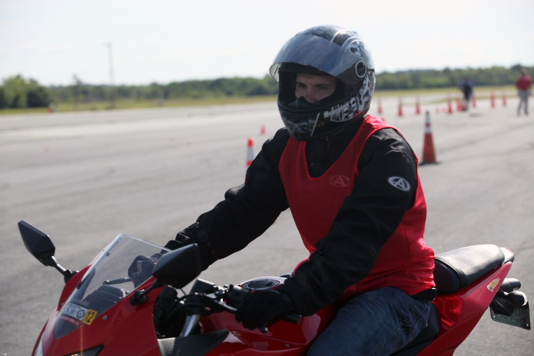 Marine Corps Auxiliary Landing Fields Bogue Field, N.C. – Motorcyclist, Sgt. Thomas Lunger, Combat Logistics Company 21, Combat Logistics Regiment 25, 2nd Marine Logistics Group, takes off to the next challenge during the Motorcycle Rodeo aboard Marine Corps Auxiliary Landing Fields Bogue Field, May 6. The course tested drivers’ skills with stops, turns, and cloverleaf turns.