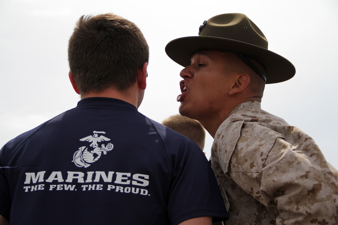 Senior drill instructor Staff Sgt. Salvador Moralessolis, 26, from Lompoc, Calif., politely asks a Recruiting Station Twin Cities mini boot camp participant to open their mouth and speak louder May 6. More than 620 men and women from Minnesota, Wisconsin and the Dakotas attended the three-day boot camp. For additional imagery from the event, visit www.facebook.com/rstwincities.