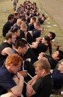 Members of the Delayed Entry Program out of Recruiting Substations Duluth and Eau Claire knock out crunches during an initial strength test at the Recruiting Station Twin Cities mini boot camp May 6. The Duluth office brought 29 individuals and 45 arrived with RSS Eau Claire. For additional imagery from the event, visit www.facebook.com/rstwincities.