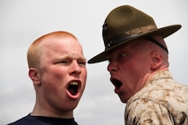 Drill instructor Sgt. Bryce E. Torrence 26, from Caldwell, Idaho, politely instructs Dacota J. Gaffke, an 18-year-old senior at Battle Lake High School, on the proper way to respond to a question at the Recruiting Station Twin Cities mini boot camp May 6. Gaffke was recruited out of the Fargo, N.D., office by Sgt. Conrad B. Billie. For additional imagery from the event, visit www.facebook.com/rstwincities.