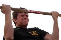 Joe Kobilarcsik, a 17-year-old junior at Mayo High School, completes one more pull-up during the Recruiting Station Twin Cities mini boot camp initial strength test May 6. Kobilarcsik, who attended as a guest, was one of 35 individuals from the Rochester, Minn., office to participate in the three-day boot camp. For additional imagery from the event, visit www.facebook.com/rstwincities.