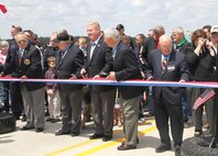 The Medal of Honor recipients get ready to cut the ribbon opening the bridge to the public. The Medal of Honor Bridge is the first bridge in the nation to be dedicated to the service members that have earned the nation's highest award for valor in combat.