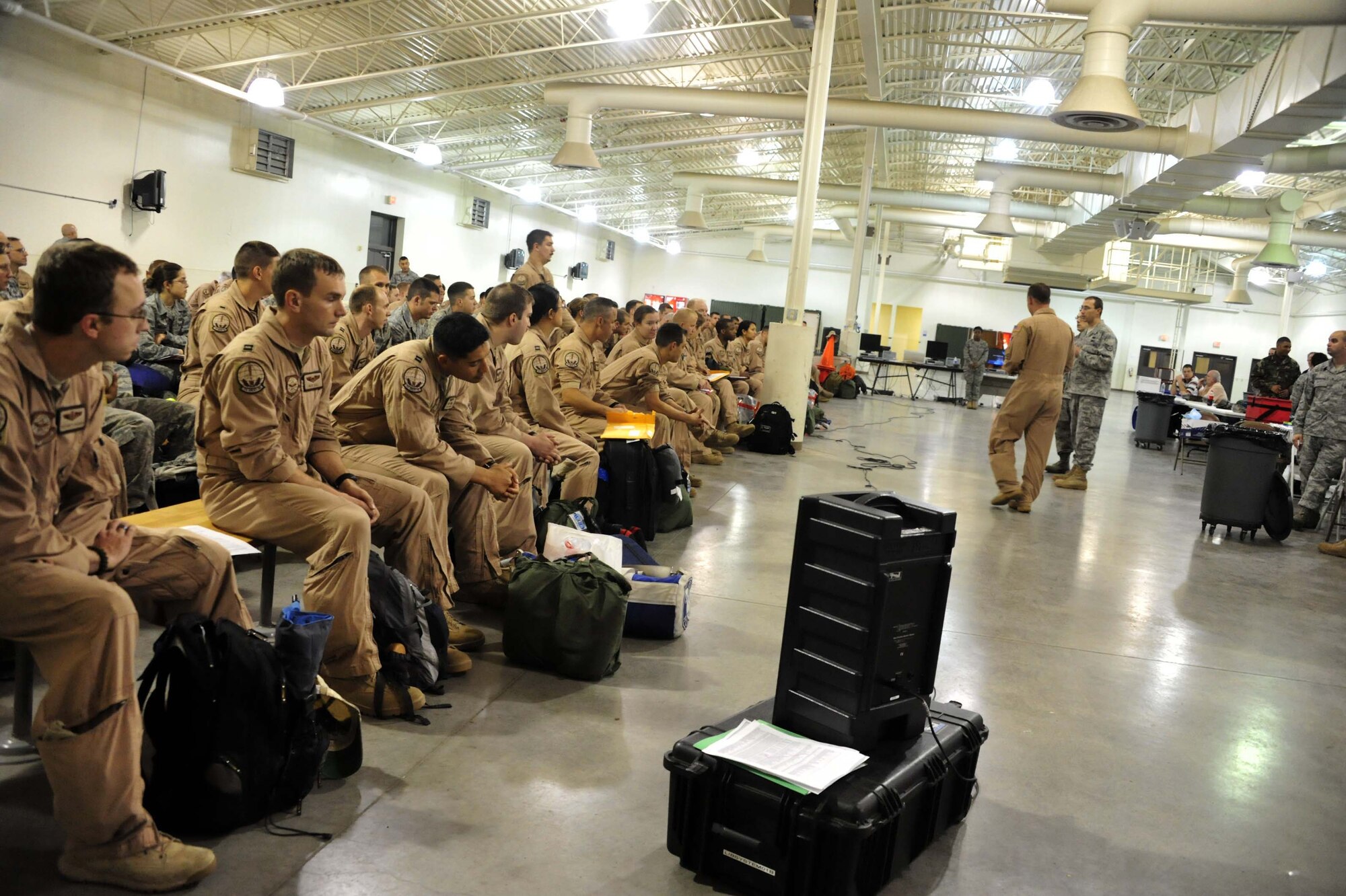 Airmen attend their re-deployment briefing after returning from a 120-day deployment May 5 at Joint Base Lewis-McChord, Wash. During their deployment, the C-17 squadron moved more than 33,900 passengers and delivered more than 81 million pounds of cargo. (U.S. Air Force photo/Airman 1st Class Leah Young)