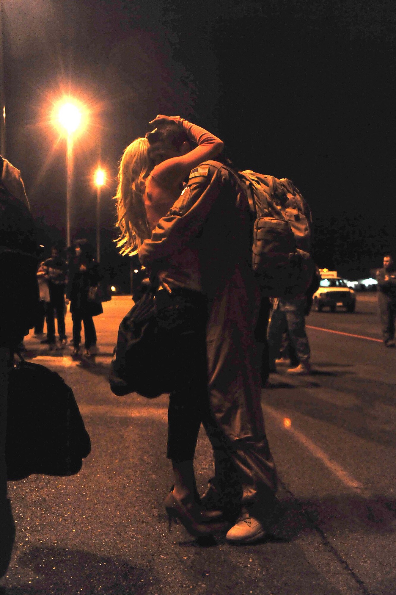 A wife embraces her husband after returning from a 120-day deployment May 5 at Joint Base Lewis-McChord, Wash. (U.S. Air Force photo/Airman 1st Class Leah Young)