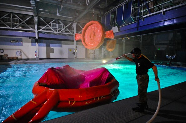 Senior Airman Andrew Lawrence, 66th Training Squadron water survival instructor, conducts non-ejection water survival class at Fairchild Air Force Base, Wash., on April 26, 2011. The course lasts two days and includes instruction in signaling rescue aircraft, hazardous aquatic life, food and water procurement, medical aspects of water survival and life raft procedures. (U.S. Air Force Photo/Tech. Sgt. J.T. May III) 